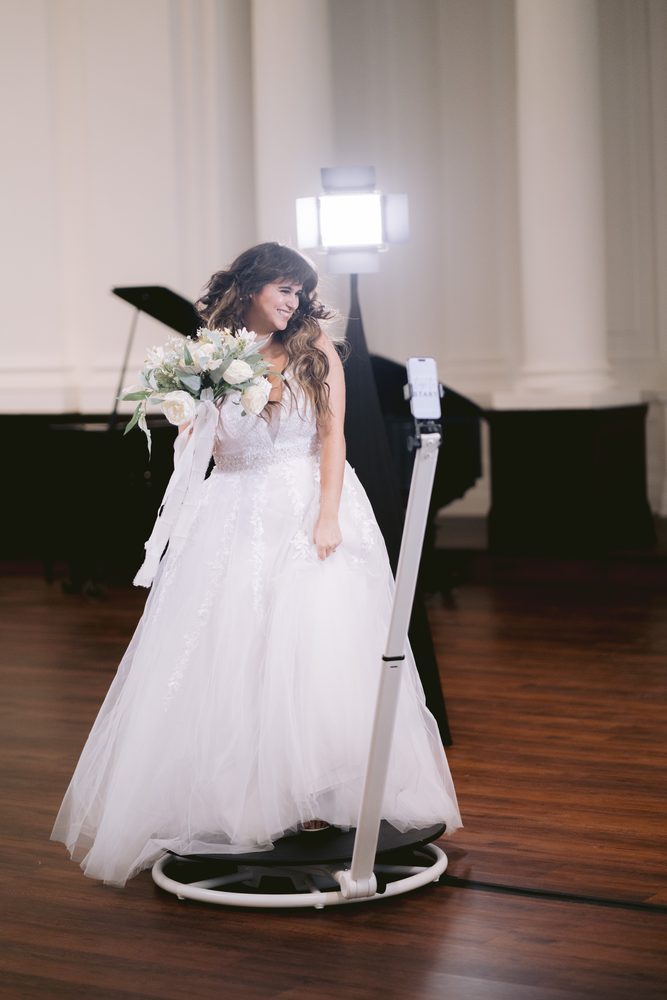 A bride spinning on The Badlands 360° platform at her wedding reception